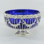 A silver plated bowl, with a blue glass liner,