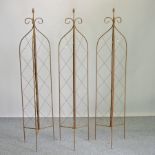 A set of three folding garden lattice spires,