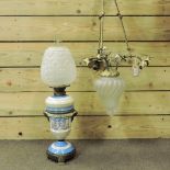 A French brass ceiling light, with porcelain roses, 72cm tall,