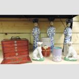 A set of three oriental figures, 42cm tall,