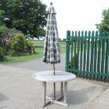 A teak circular garden table, 109cm,
