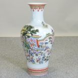 A large Chinese porcelain vase, decorated with a landscape,