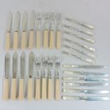 A collection of silver and mother of pearl handled knives and forks,
