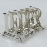 A silver plated letter rack,