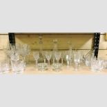 A shelf of cut glass, to include tumblers, decanters and an ice bucket,