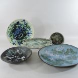 A collection of studio pottery chargers and dishes, largest 38cm,