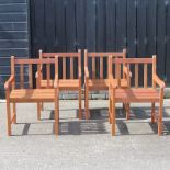 A set of four hardwood garden chairs