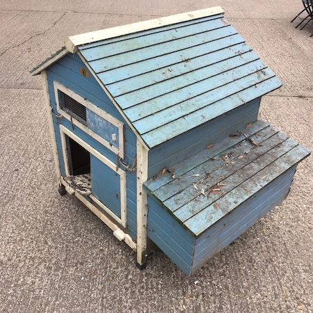 A blue painted wooden chicken coop,