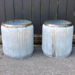 A pair of galvanised circular garden planters,