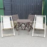 A teak slatted garden table, 57 x 67cm,