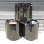 A set of three black garden pots,