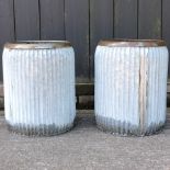 A pair of galvanised circular garden planters,