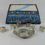 An early 20th century silver dish, London 1918, together with four silver napkin rings,