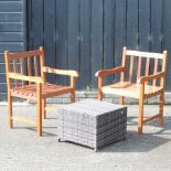 A pair of hardwood garden chairs, together with a rattan side table,