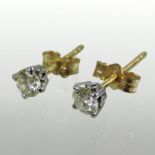 A pair of 18 carat gold diamond stud earrings, approximately 0.