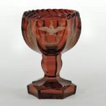 A 19th century Bohemian ruby glass vase, of faceted pedestal shape,