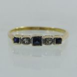 An 18 carat gold sapphire and diamond five stone ring