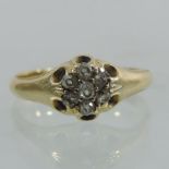 An unmarked six stone diamond gentleman's ring