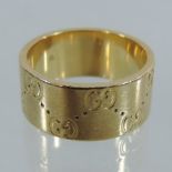 An 18 carat gold Gucci wedding band,