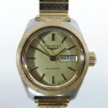 A Longines ladies automatic steel cased wristwatch, the gilt dial with date aperture,