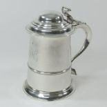 A George III silver tankard, of plain tapered shape, with a domed hinged lid,