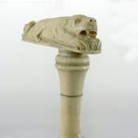 A 19th century carved ivory walking stick handle, in the form of a tiger,