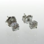 A pair of 18 carat white gold and diamond ear studs, each approximately 0.