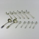 A collection of five George III Old English pattern table spoons, various dates and makers,