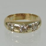 A large 9 carat gold and diamond set gentleman's gypsy ring