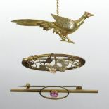 A 9 carat gold brooch in the form of a pheasant, the eye inset with a red gemstone,