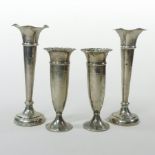 A pair of Edwardian silver spill vases with flared rims, Birmingham 1905, 19cm tall,