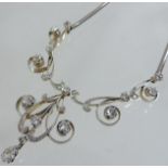 An Edwardian unmarked gold and platinum set diamond necklace,