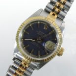 A Rolex ladies oyster perpetual datejust bi-metal wristwatch, the black dial with gilt baton hours,