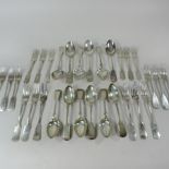 A set of six early 20th century silver fiddle pattern dessert spoons, by James Dixon and Sons,