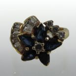An unmarked sapphire and diamond cluster ring,
