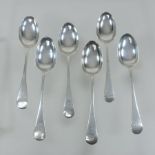 A collection of six Edwardian silver Old English pattern dessert spoons,