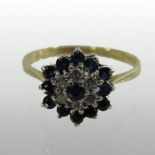 An 18 carat gold sapphire and diamond cluster ring,