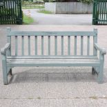 A green painted garden bench,