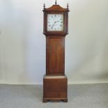 An early 19th century oak cased longcase clock, having a painted dial and thirty hour movement,