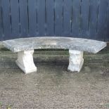 A reconstituted stone curved garden bench,