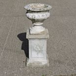 A reconstituted stone garden urn,