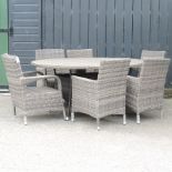 A rattan oval dining table, 180 x 122cm,