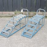 A pair of blue painted metal car ramps,