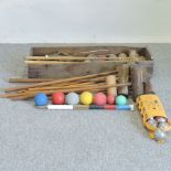 A vintage croquet set, in a wooden box,