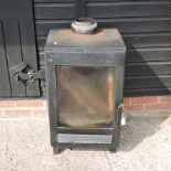 A cast iron log burner, with a glazed door,