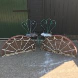 A pair of painted metal garden chairs,