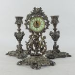 A late 19th/early 20th century ornate bronzed three piece clock garniture,
