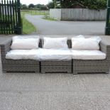 A grey rattan three seater sofa, 258cm,