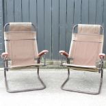 A pair of cantilever reclining garden chairs