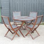 A teak octagonal garden table, 102cm,